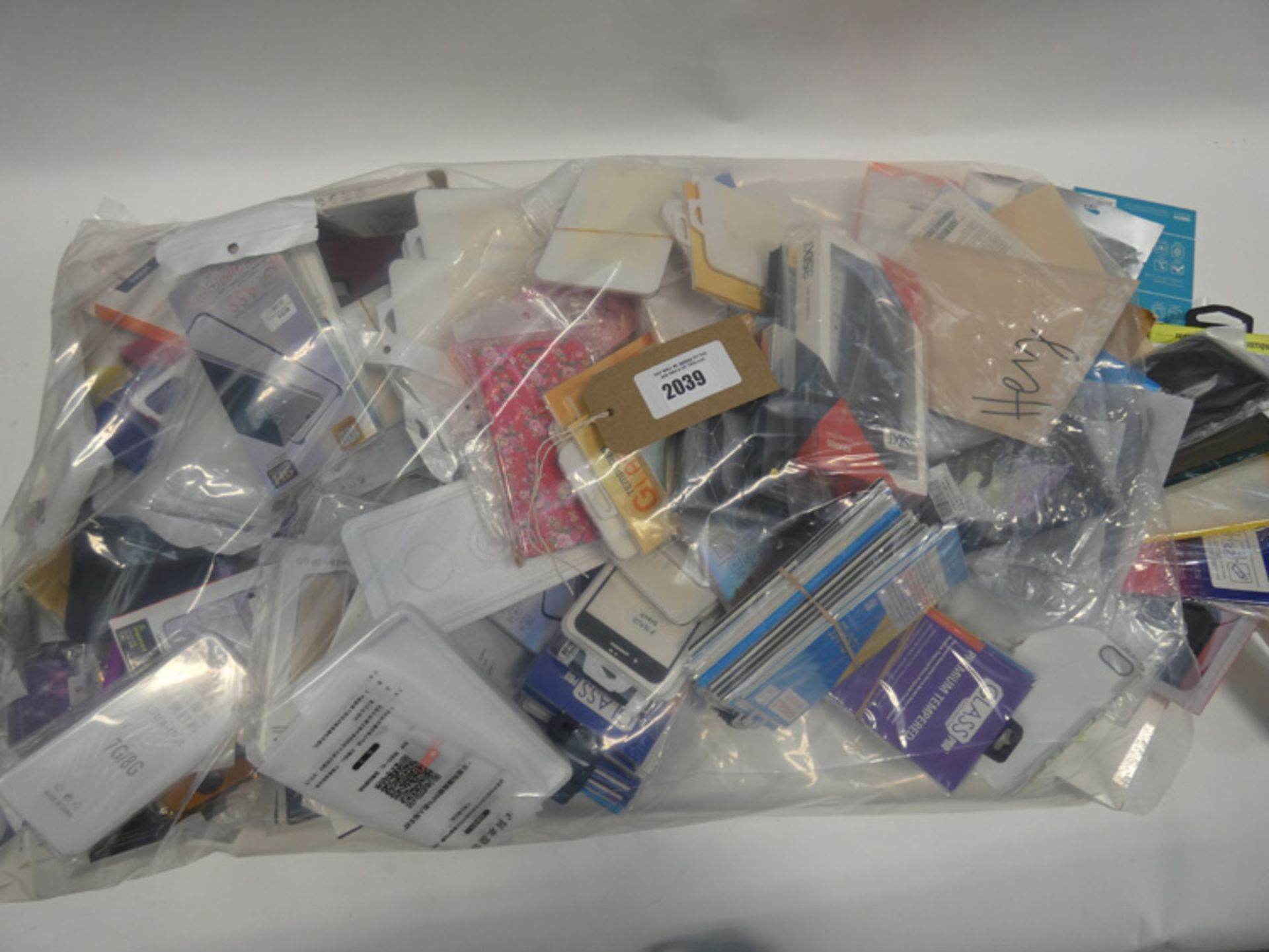 Bag containing quantity of mobile phone cases and covers