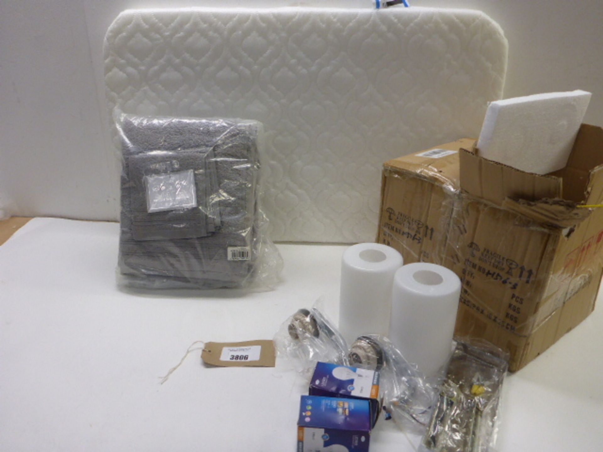 2 boxes of 2 Boutique lamps, cot mattress and Bale of 6 towels in grey