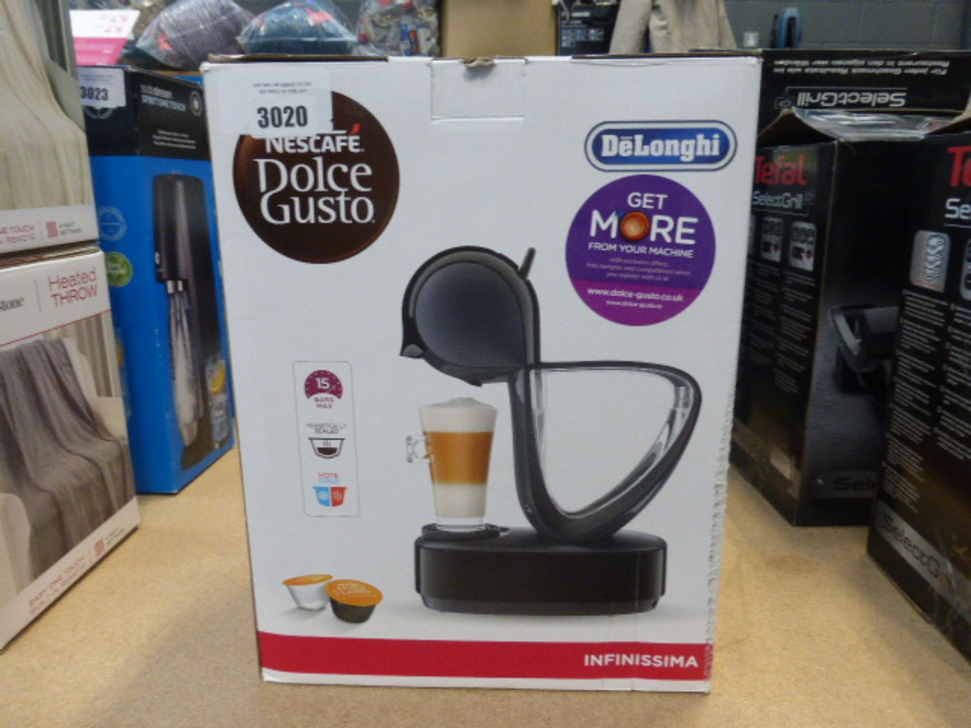 A boxed Nescafe Dolce Gusto Infinissima coffee machine