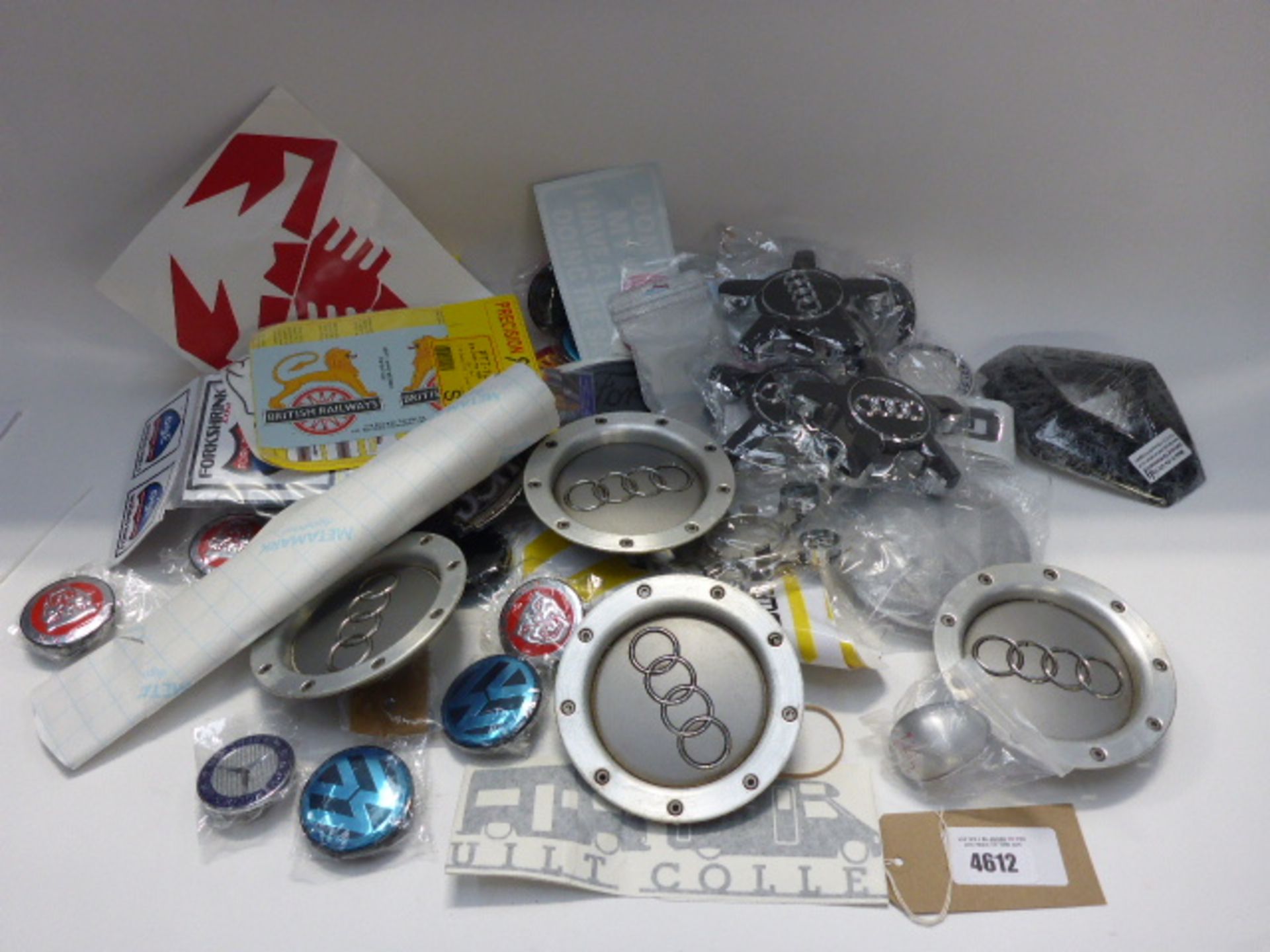 Bag containing car badges, including Audi, Mercedes, Volkswagen, Ford, Renault, etc