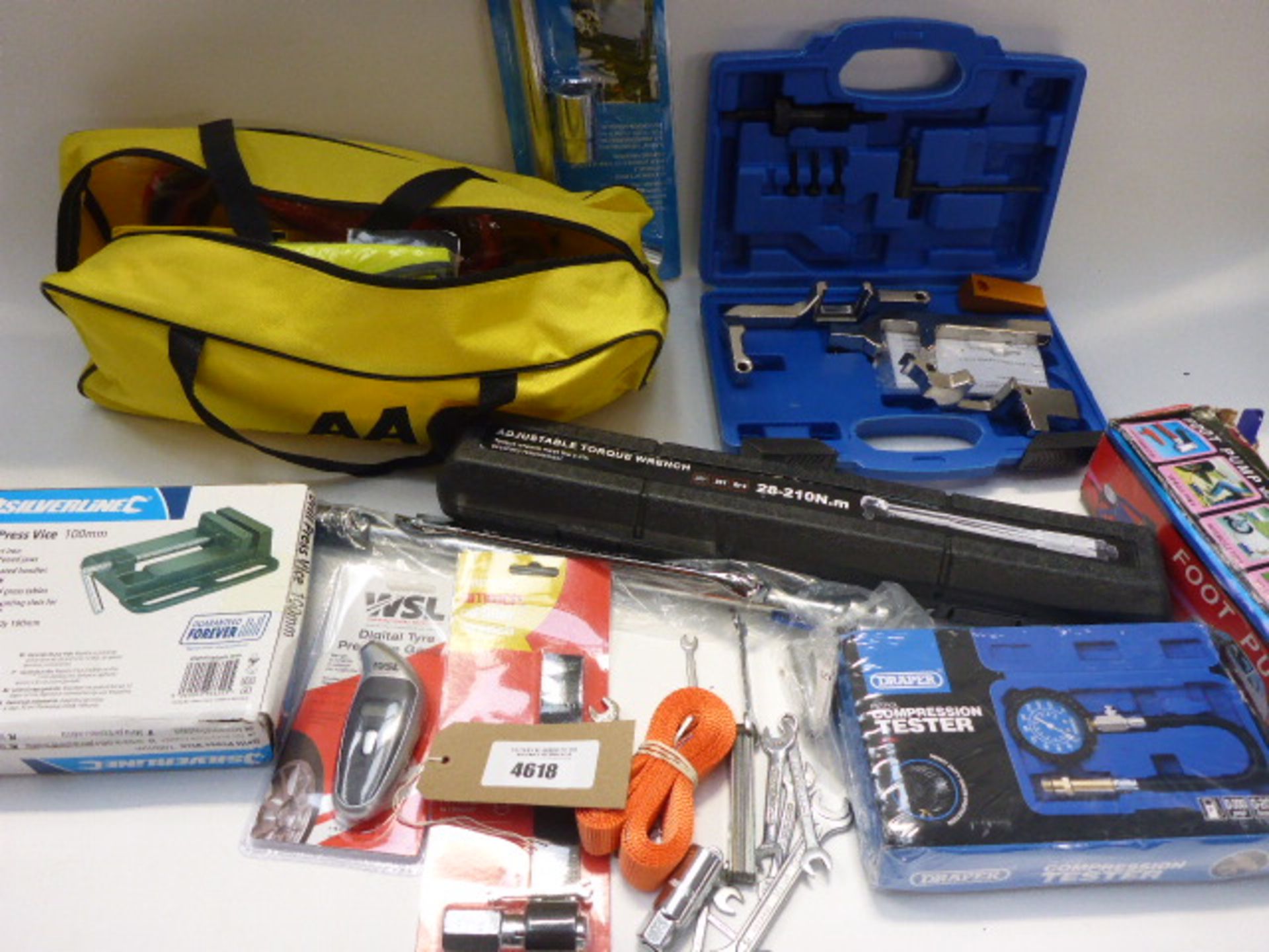 Bag containing AA breakdown kit, wheel wrench, compression tester, foot pump, torque wrench, drill