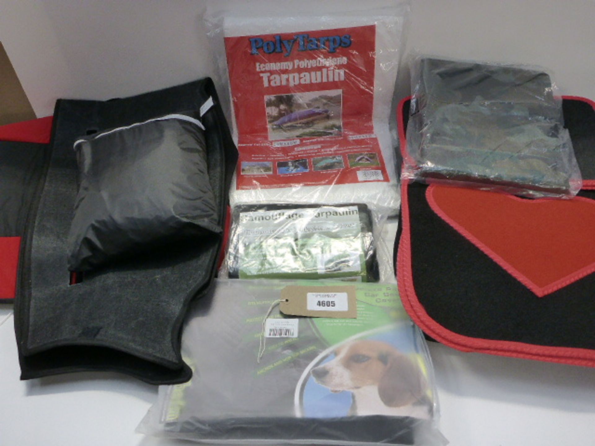 Bag containing Love Heart car mats, deluxe pet car seat cover, tarpaulins, and other car seat covers
