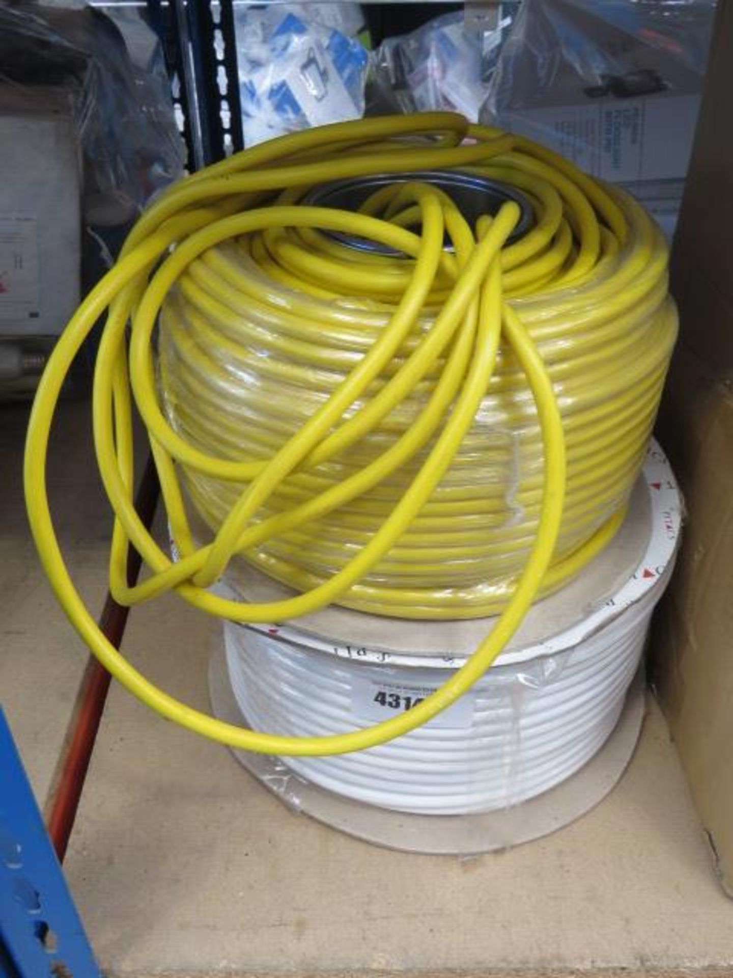 Roll of white cable and yellow cable