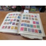 Lincoln stamp album and catalogue with illustrations and maps containing various worldwide stamps