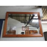 Rectangular pine framed and bevelled wall mirror