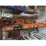 Shelf containing large quantity of various Lima HO scale model railway componants