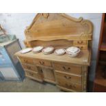 Early 20th C pine sideboard with 7 drawers, single door cupboard and a decorative gallery section