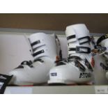 Pair of Atomic ski boots in white and orange