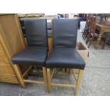 Pair of brown leatherette upholstered bar stools on wood effect bases