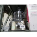 Unboxed Kenwood food processor with a quantity of various accessories