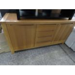 Modern light oak sideboard with 4 central drawers and 2 cupboards