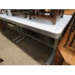 Glass topped metal framed height adjustable desk