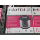 Boxed Instant Pot multi use pressure cooker