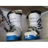 Pair of Solomon ski boots in blue and white