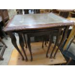 2064 - Mahogany nest of 3 glass topped tables