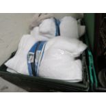 Crate containing white bathroom towels