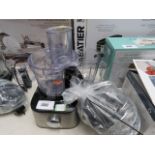 Unboxed Kenwood food processor together with bag of various attachments and two jug attachments