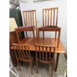 Mid Century teak extending dining table with 4 red upholstered chairs Collector's Item: Sold subject