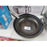 3 used stainless steel woks