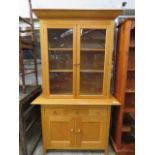 Modern oak effect glazed display cabinet with cupboards and drawers to base