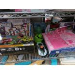 Shelf containing quantity of various kids toys incl. Crazy Trax Extreme set, construction set,