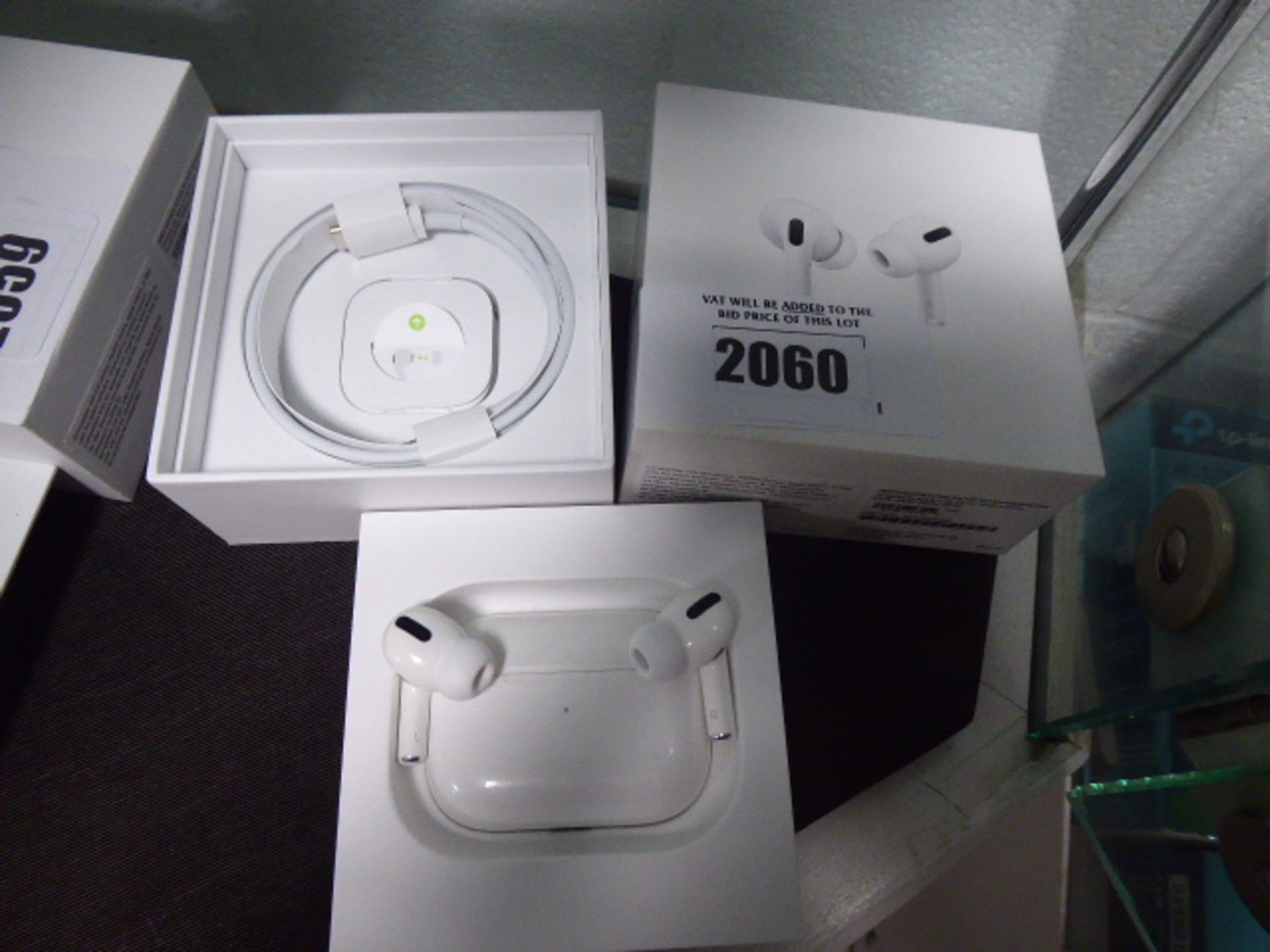 Apple airpods pro with wireless charging case, spare ear tips, charging cable and box