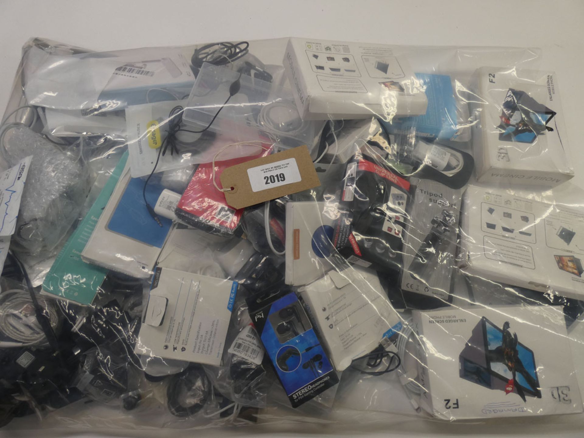 Bag containing quantity of various mobile phone accessories; cables, adapters, leads, earphones,