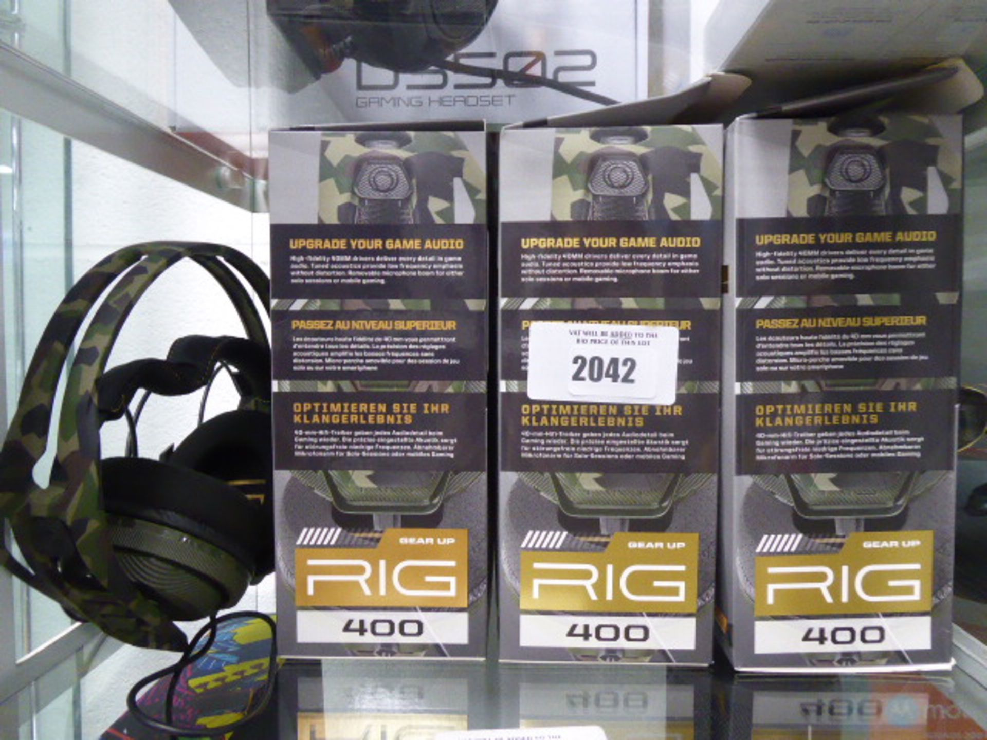 3 boxed and 1 unboxed pair of Rig 400 gaming headsets by Plantronics