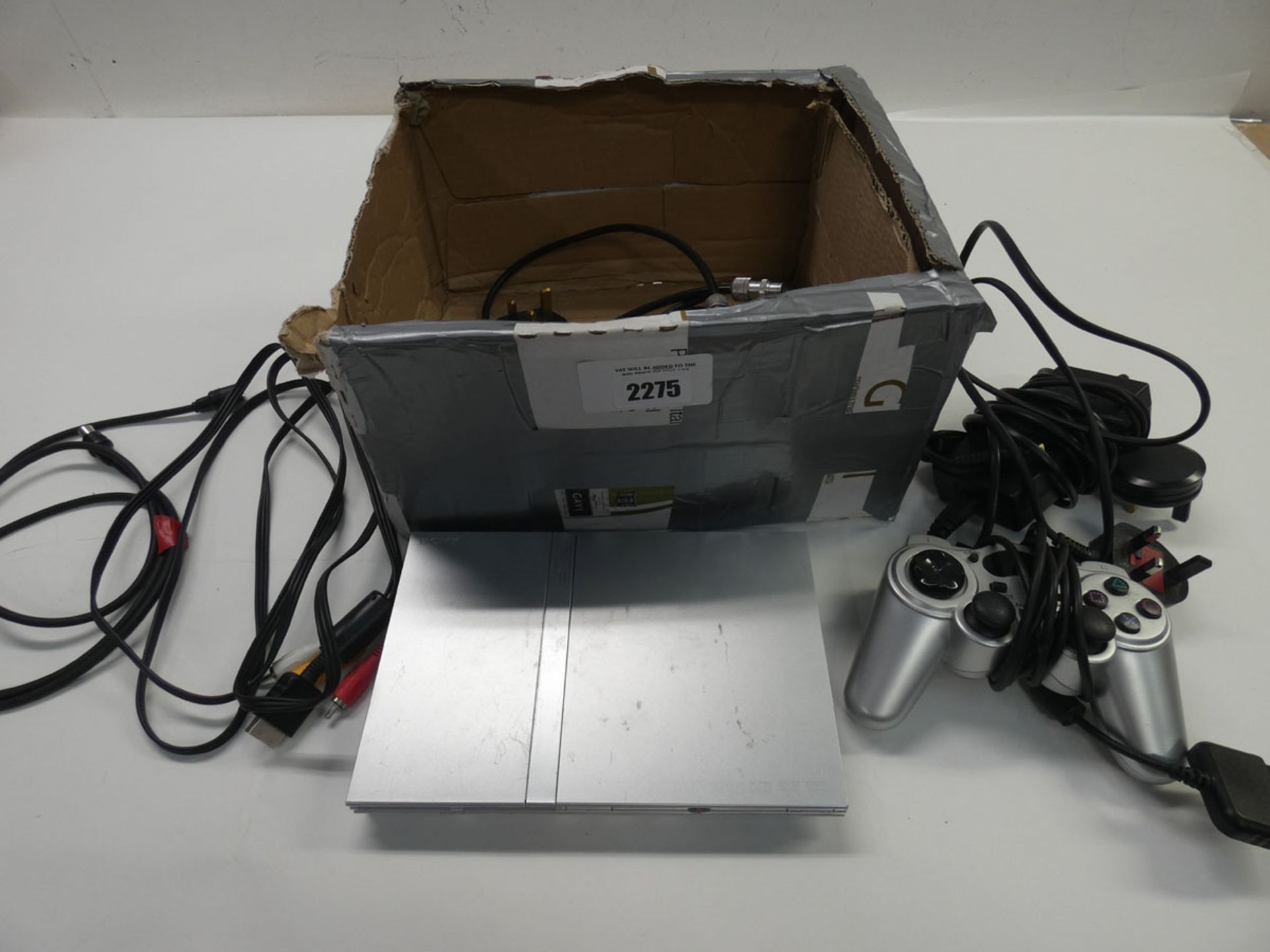 PS2 Slim in silver with accessories