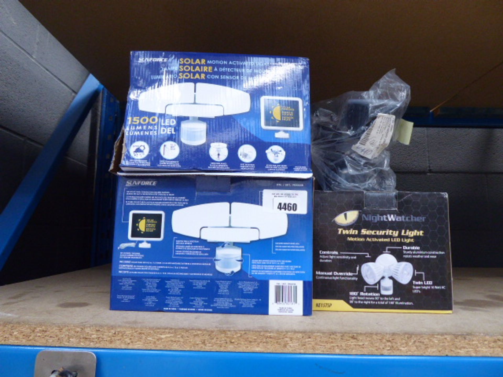3 boxed and 1 unboxed security lights