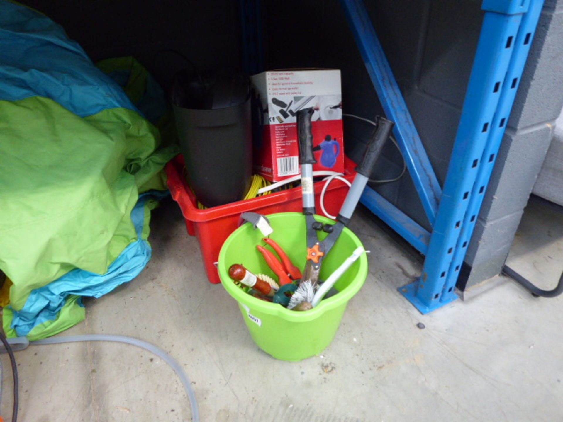 Green bucket of assorted tools and a red plastic box containing; a steamer, cable and small shredder