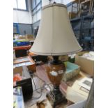 An urn shaped table lamp with shade
