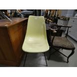 Yellow painted molded fibreglass chair