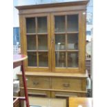 Glazed oak bookcase with cupboard base under