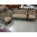 Carved and floral patterned three piece Edwardian parlour suite