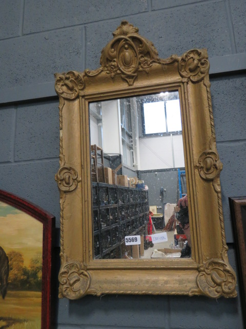 A rectangular Victorian mirror in gilt frame