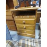 Narrow pine chest of three drawers with shelf over