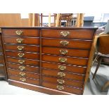 (21) Faux mahogany chest of eight drawers