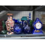 A cage containing blue and green glass, to include: lustres, decanter, various bowls, plus a