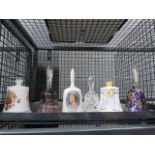 A cage containing 6 glass and ceramic bells