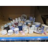 A cage containing graduated jugs, blue & white crockery, pressed glass, commemorative mugs and