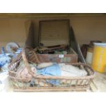 A travelling trunk with a quantity of tin plate toys, plus a doll in basket