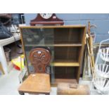 Oak bookcase with glazed sliding doors