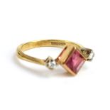 A 9ct yellow gold ring set diamond shaped pink tourmaline and two brilliant cut diamonds in an