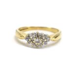 A 9ct yellow gold ring set fifteen small diamonds in a tiered setting, ring size N, 2.