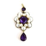 A yellow metal mounted pendant of cluster form centrally set heart shaped amethyst within a border