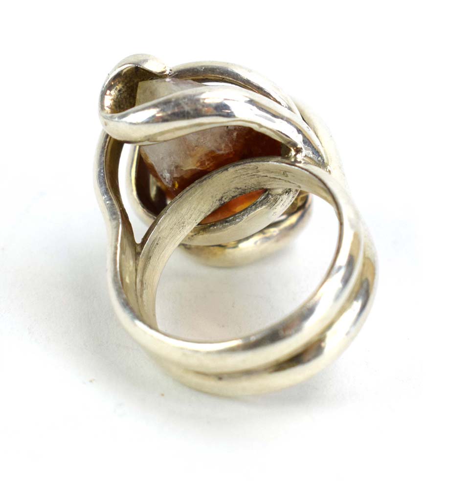 A late 20th century silver dress ring set amber coloured quartz within an entwined setting, - Image 4 of 7