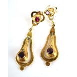 A pair of late 19th/early 20th century yellow metal ear pendants of teardrop form,