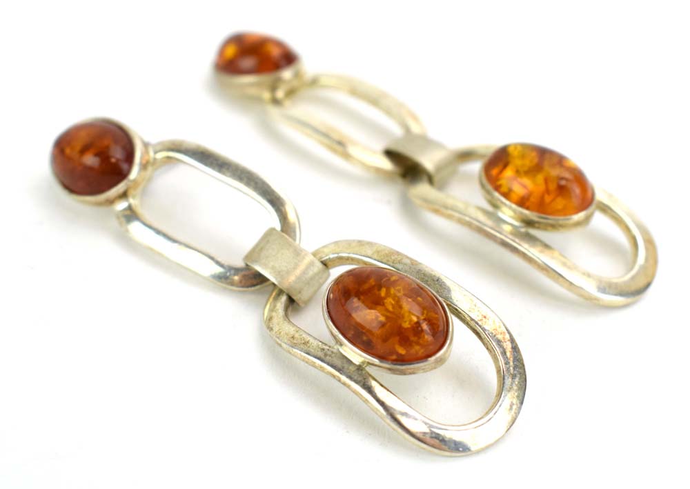 A late 20th century silver dress ring set amber coloured quartz within an entwined setting, - Image 6 of 7