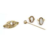 A 9ct yellow gold ring set oval opal, a similar openwork brooch,